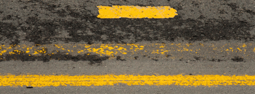 close up of the dividing lines on a highway